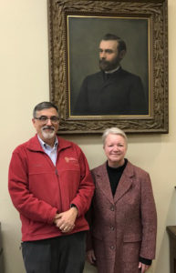 AIHP Executive Greg Higby and Jeanette Roberts, the former Dean of the UW-Madison School of Pharmacy, pose with a portrait of Edward Kremers, the second Director of the UW School of Pharmacy.
